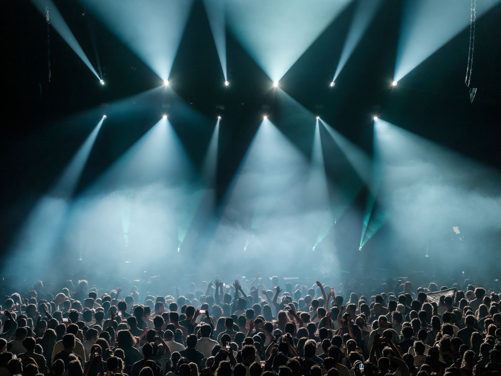 Crowd at a live concert under stage lights